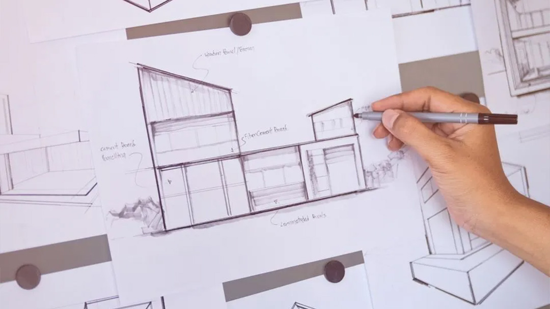 Mano dibujando croquis arquitectónico